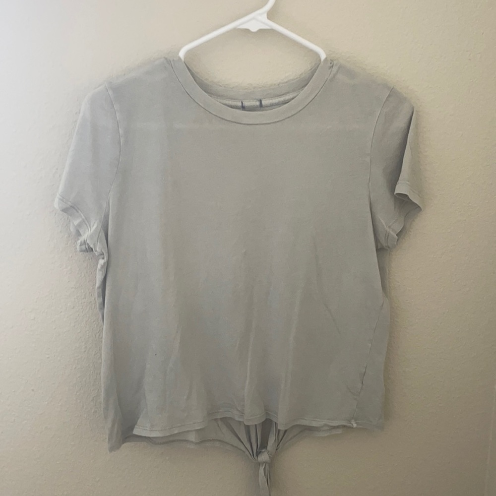 Grey baby tee tie-back top with green undertone